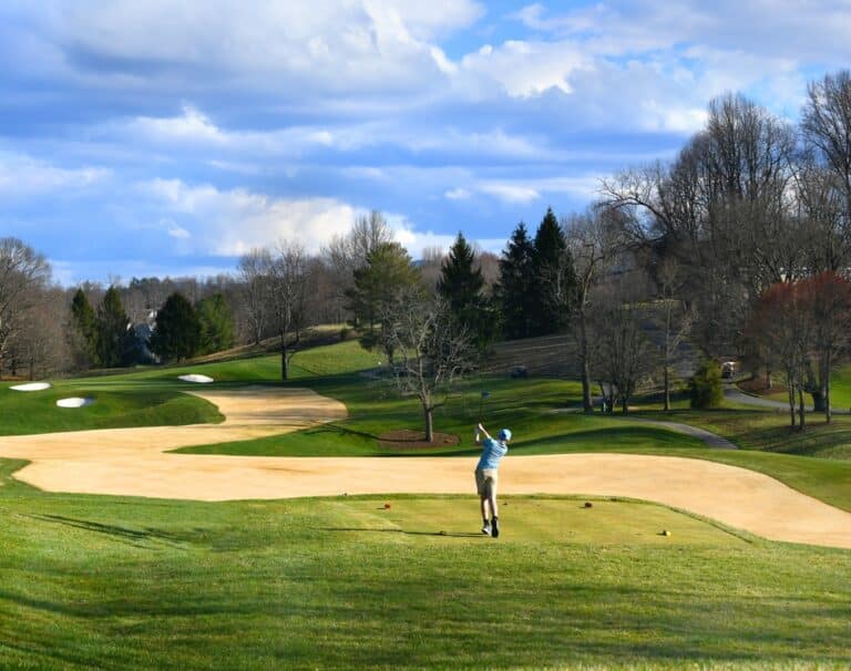 Young,male,teen,,participating,in,a,golf,tournament,,hits,the