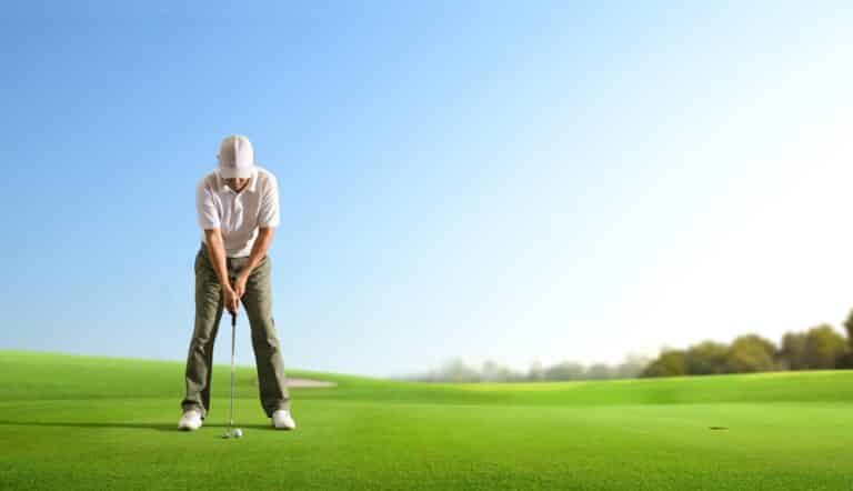 Golfer,putting,golf,ball,to,the,hole,on,green,golf.
