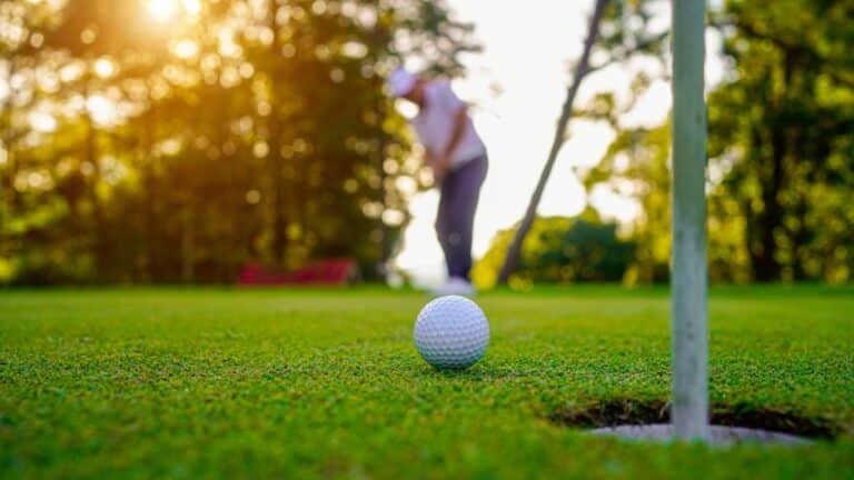 Golfers,are,putting,golf,in,the,evening,golf,course,golf