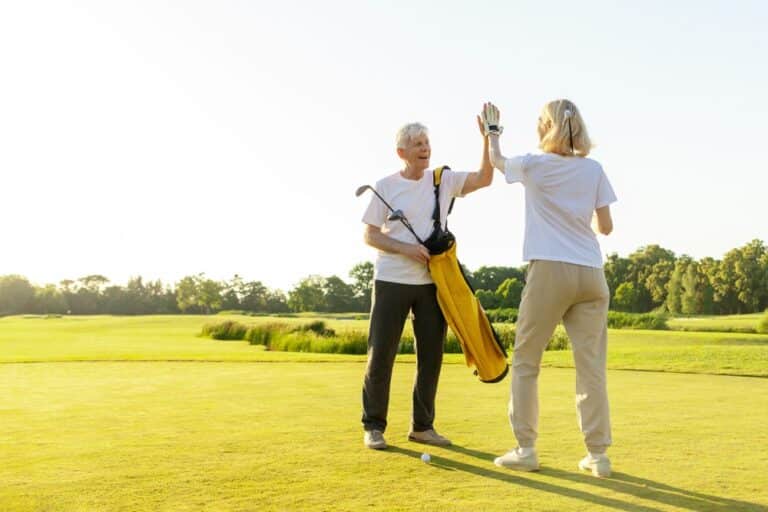 Elderly,senior,couple,in,uniform,celebrating,victory,and,success,in